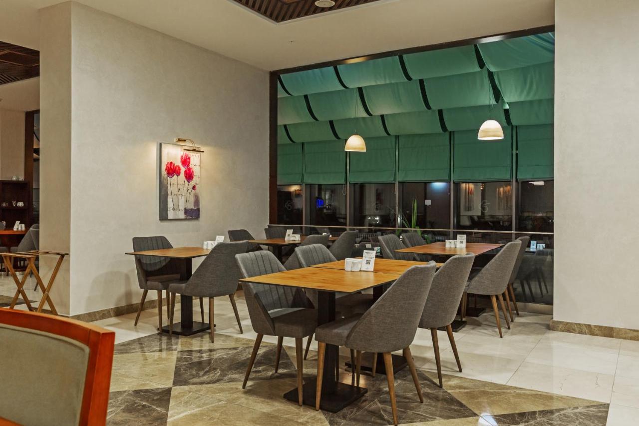 Dedeman Oskemen Tavros Hotel Ustʼ-Kamenogorsk Εξωτερικό φωτογραφία The restaurant